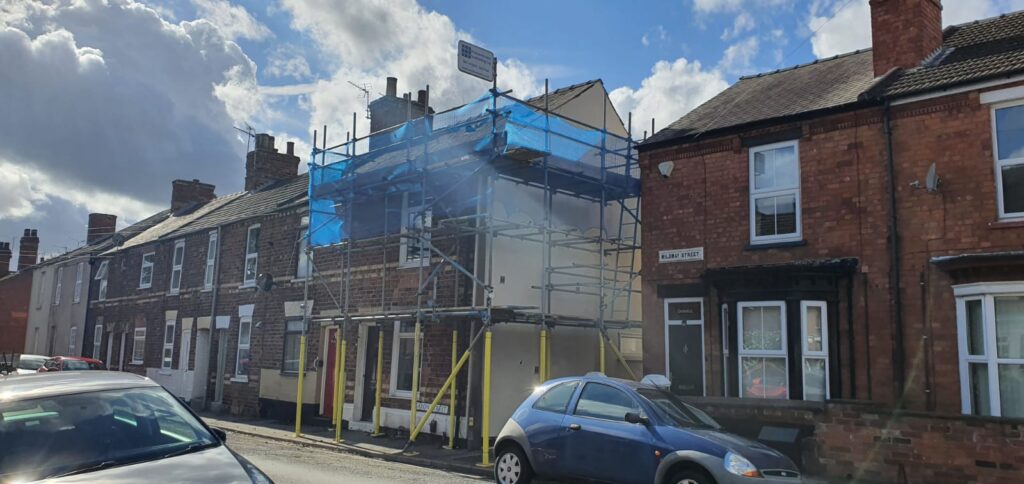 terraced house with scaffolding on the front - image 2