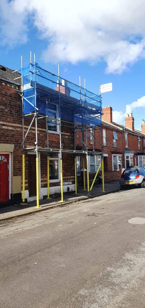 terraced house with scaffolding on the front