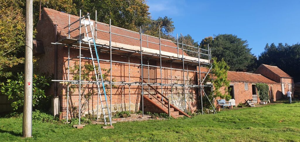 old building with scaffolding for access to roof - image 3