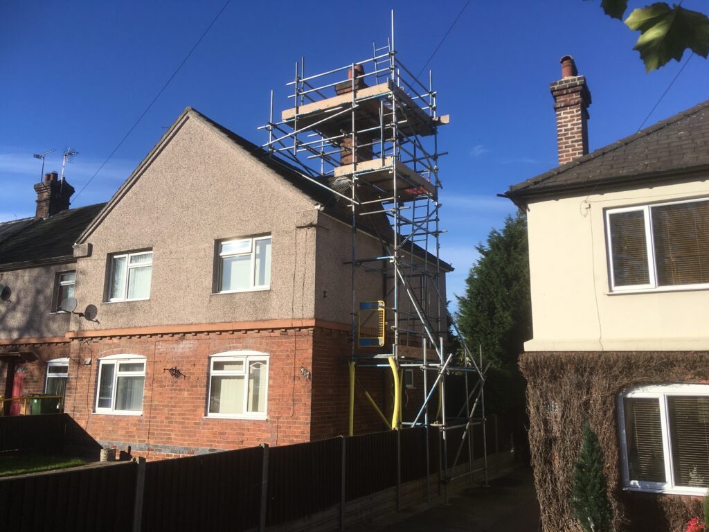 scaffolding on side of house for chimney work - image 3