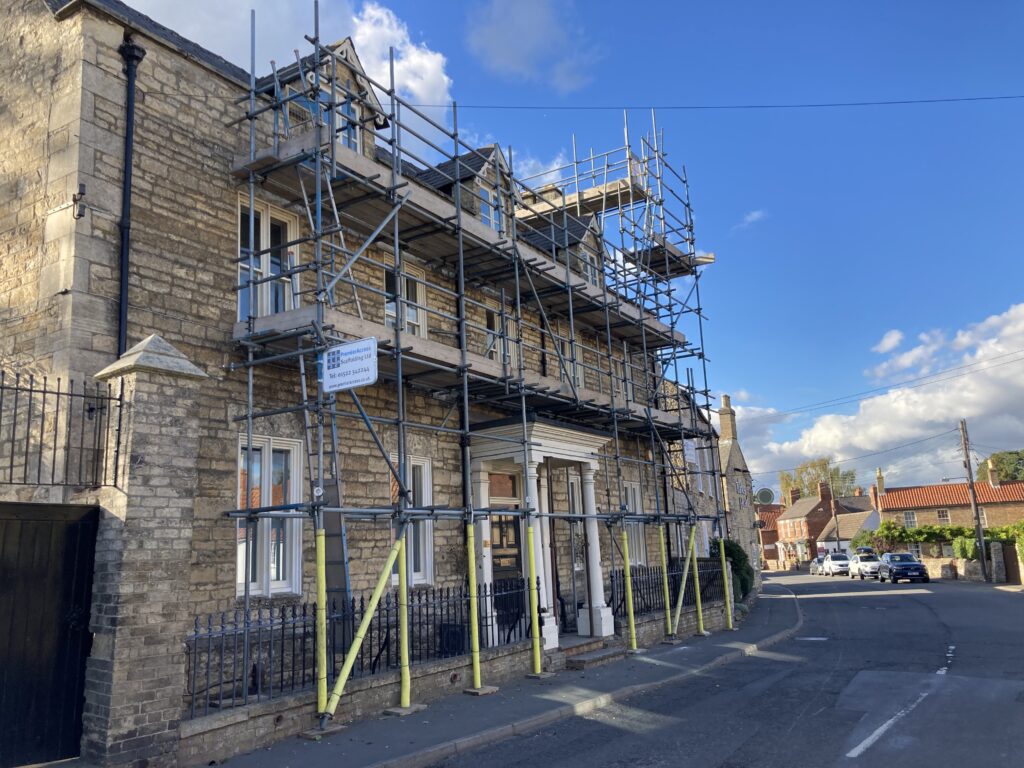 Scaffolding on the front of a house in Heighington for decoration works & flue installation - image 2