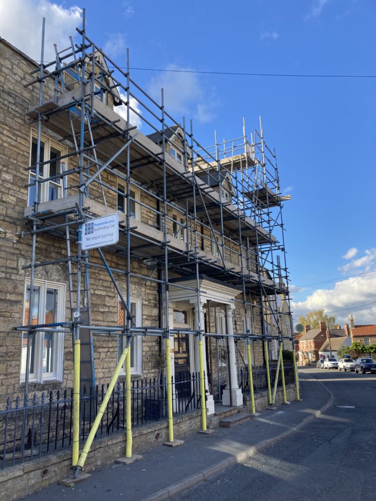 Scaffolding on the front of a house in Heighington for decoration works & flue installation