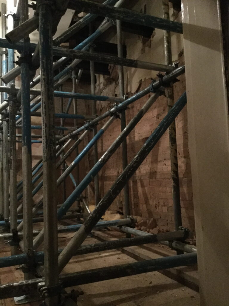 scaffolding inside of a building for renovation - image 2