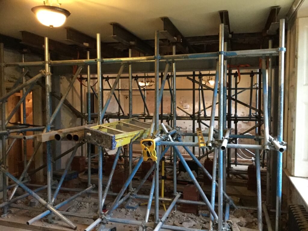 scaffolding inside of a building for renovation - image 4