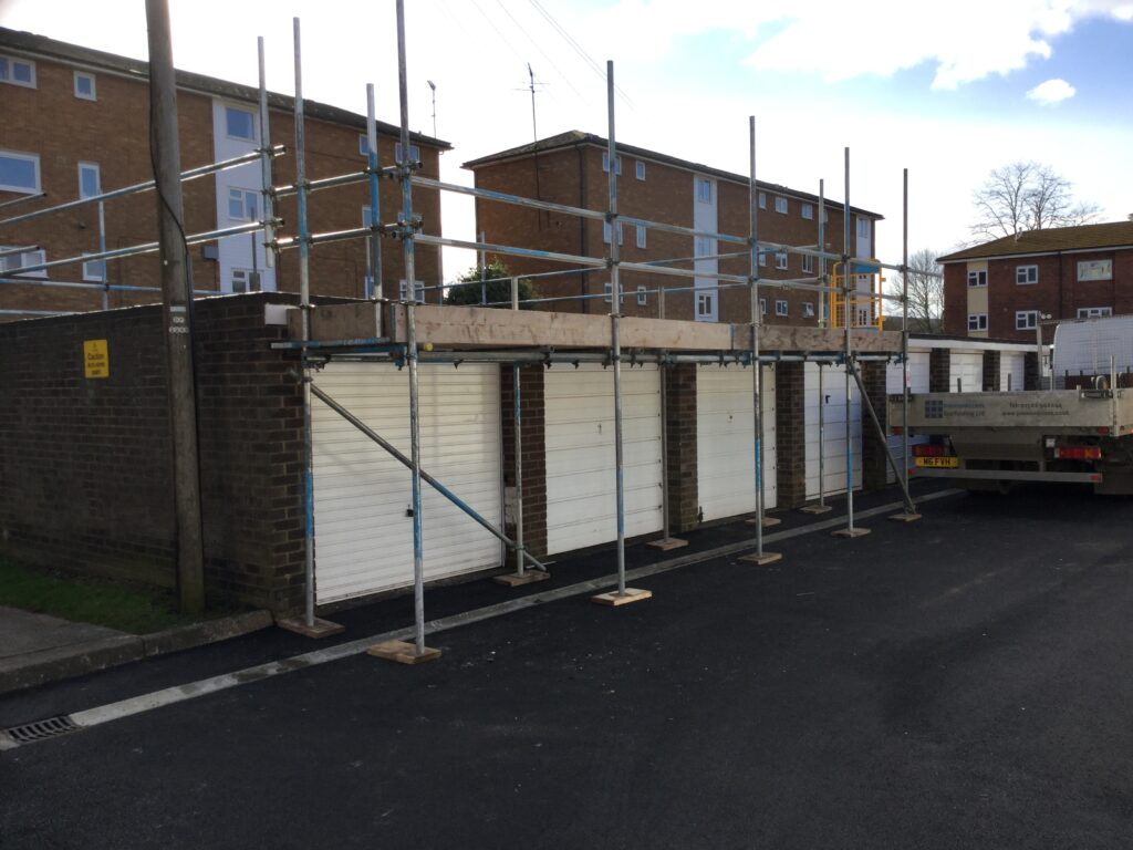 scaffolding on some flat block garages