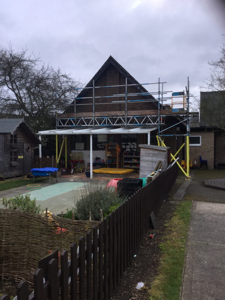 scaffolding on the back of a small nursery - image 2