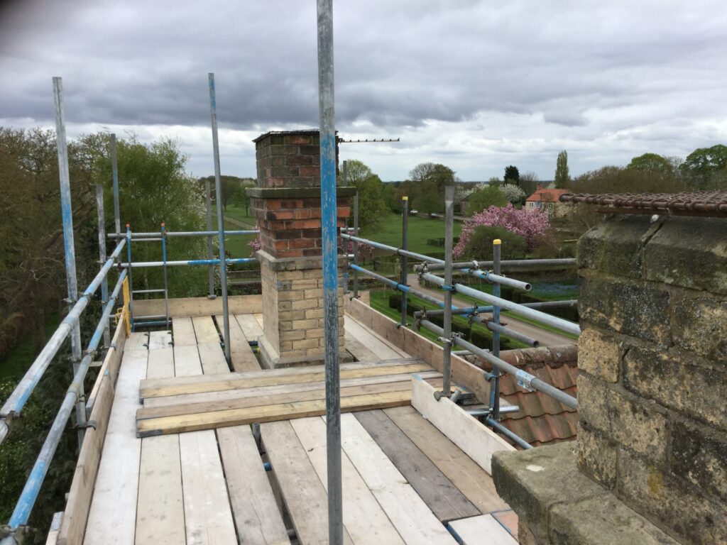 scaffolding surrounding a chimney