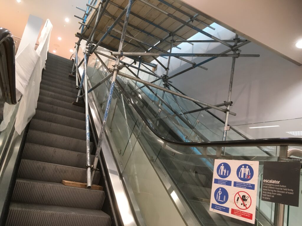 scaffolding over escalator in shop located in Lincoln