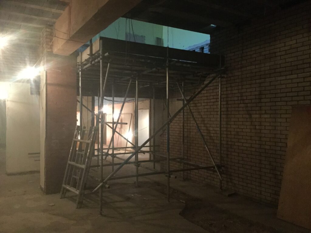 Heavy duty scaffolding inside of Active Nation in Birchwood for floor slab removal