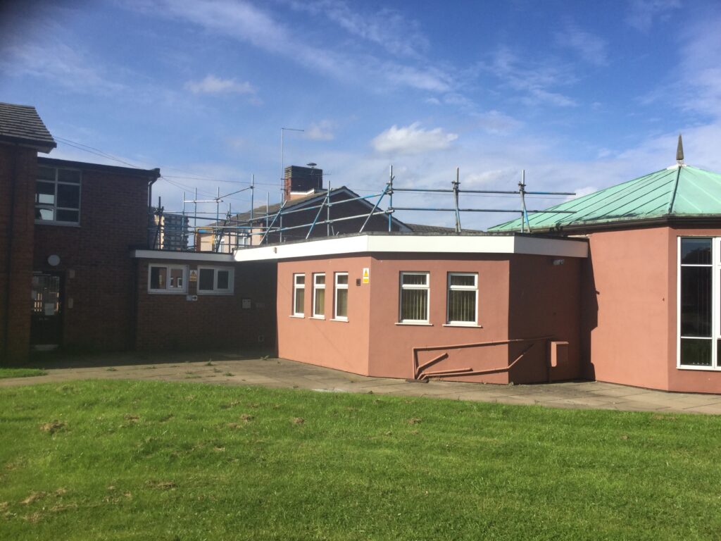scaffolding on the first roof of a building