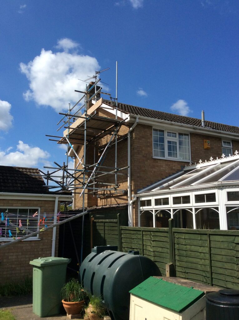 scaffolding on the side of a house with conservatory - image 2