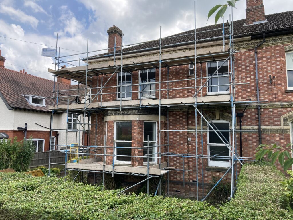 Scaffolding on front of old house