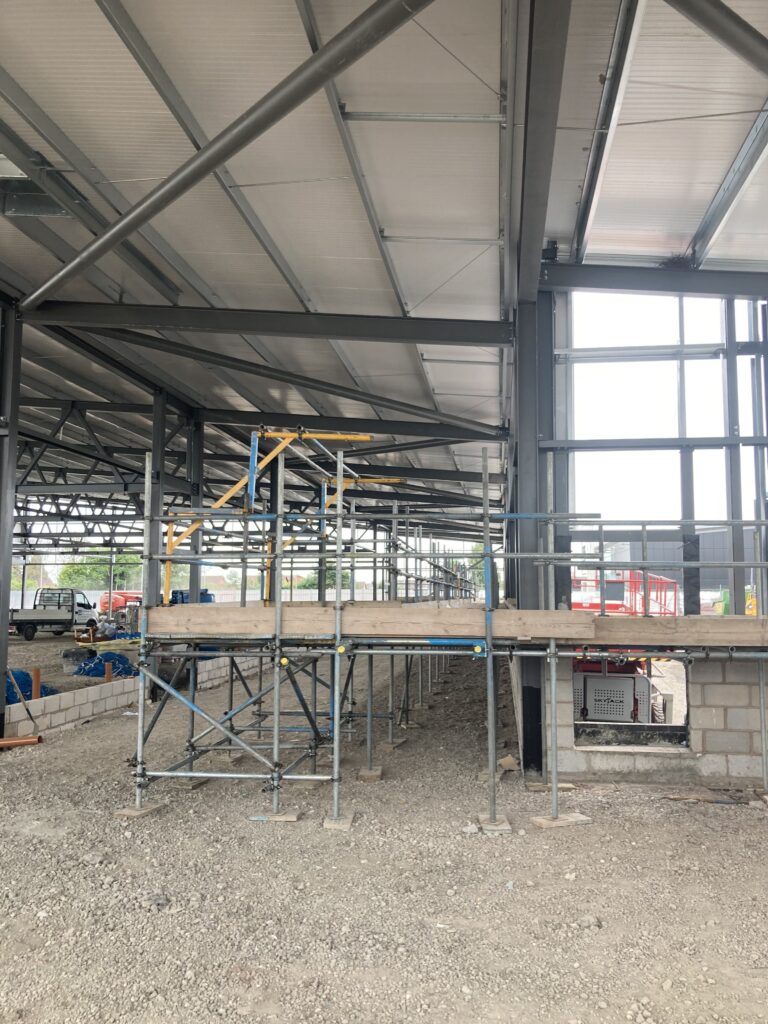 row of scaffolding inside of new ALDI store in lincoln for construction of interior walls - image 3