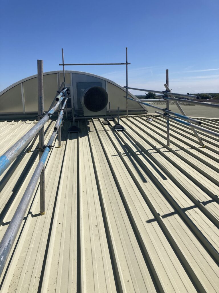 scaffolding on top of roof for access to vent - image 1