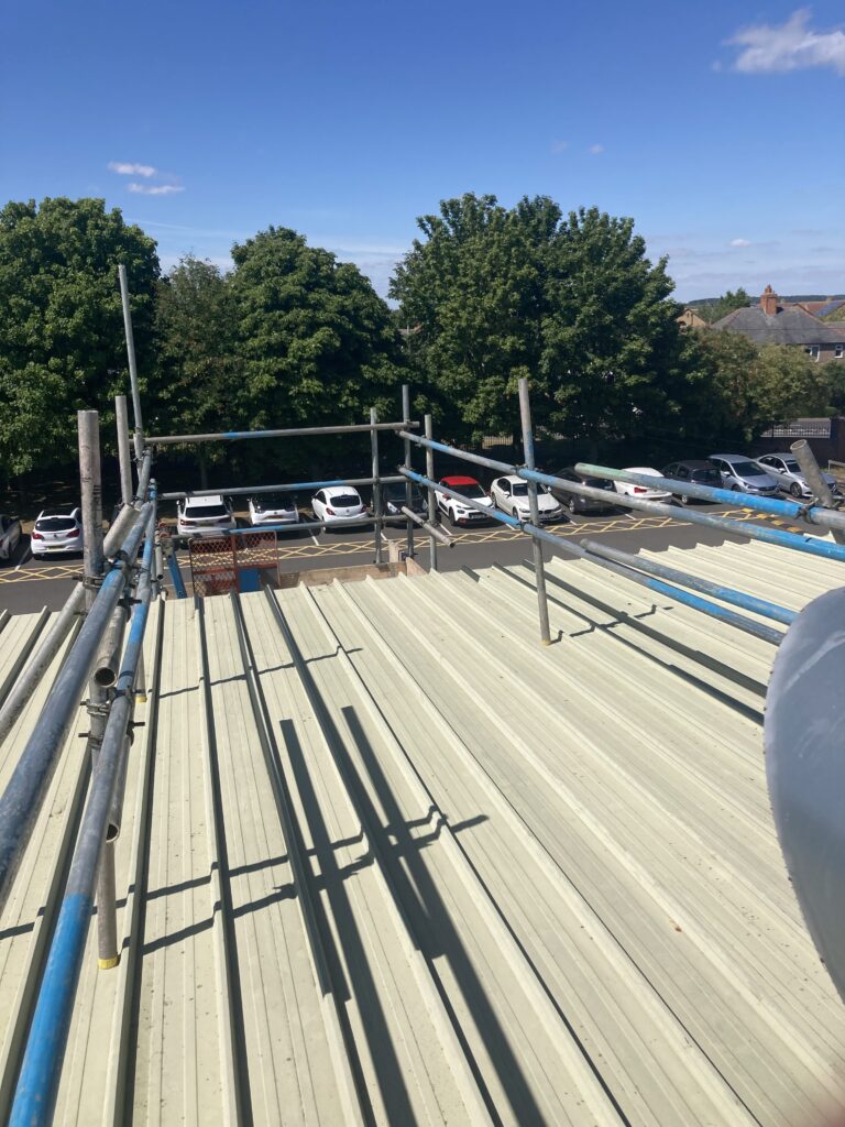 scaffolding on top of roof for access to vent - image 2