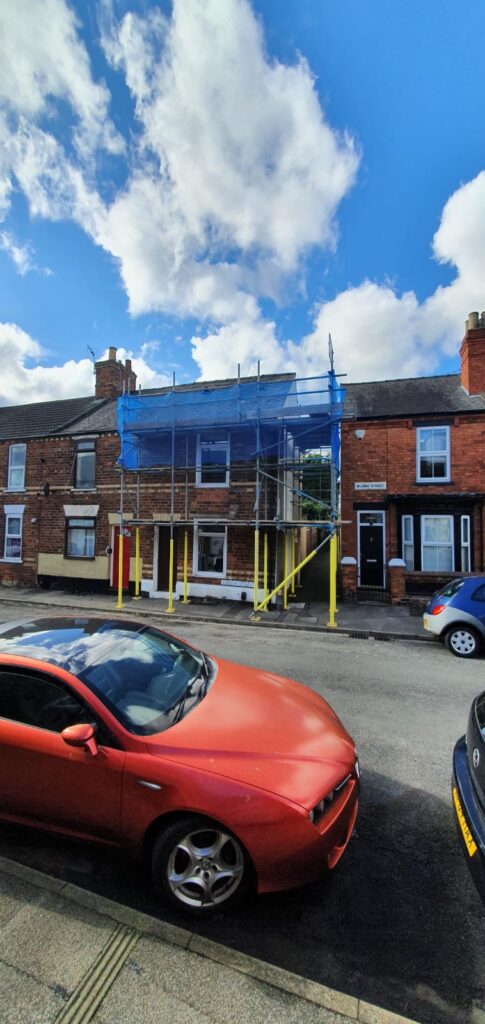 terraced house with scaffolding on the front - image 5