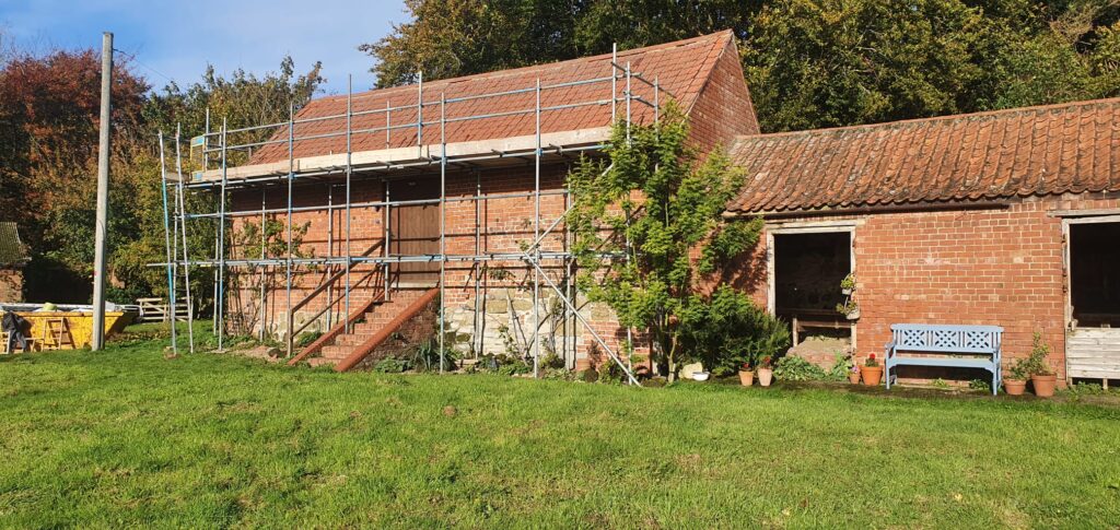 old building with scaffolding for access to roof - image 1