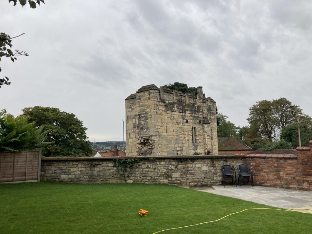 a back garden near an old medieval arch in Lincoln