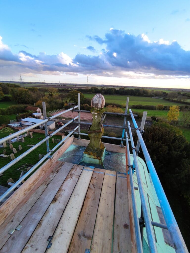 scaffolding at the top of a church