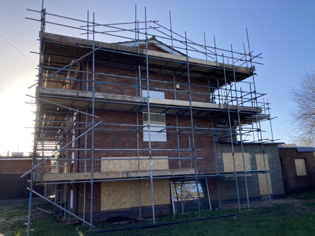 scaffolding surrounding an entire building in Lincoln
