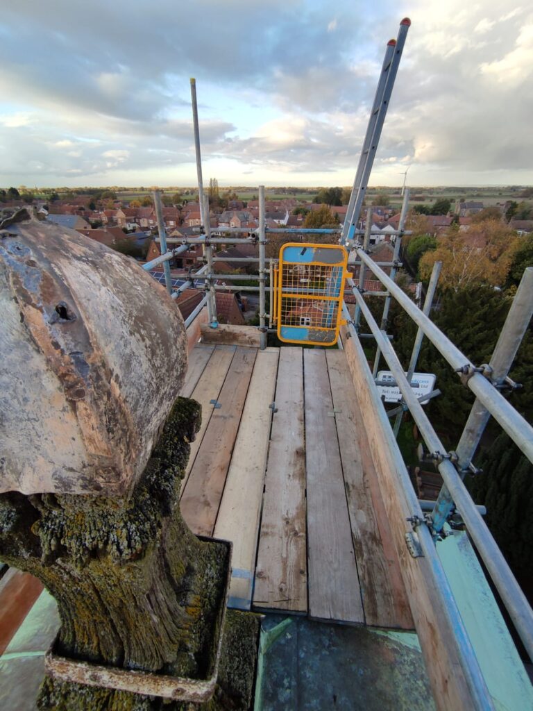 scaffolding on top of a church