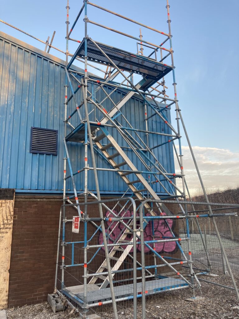 commercial scaffolding equipment on the back of a building in Lincoln
