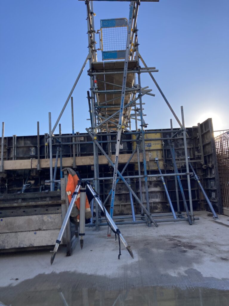 a small amount of scaffolding and other safety equipment on a construction site