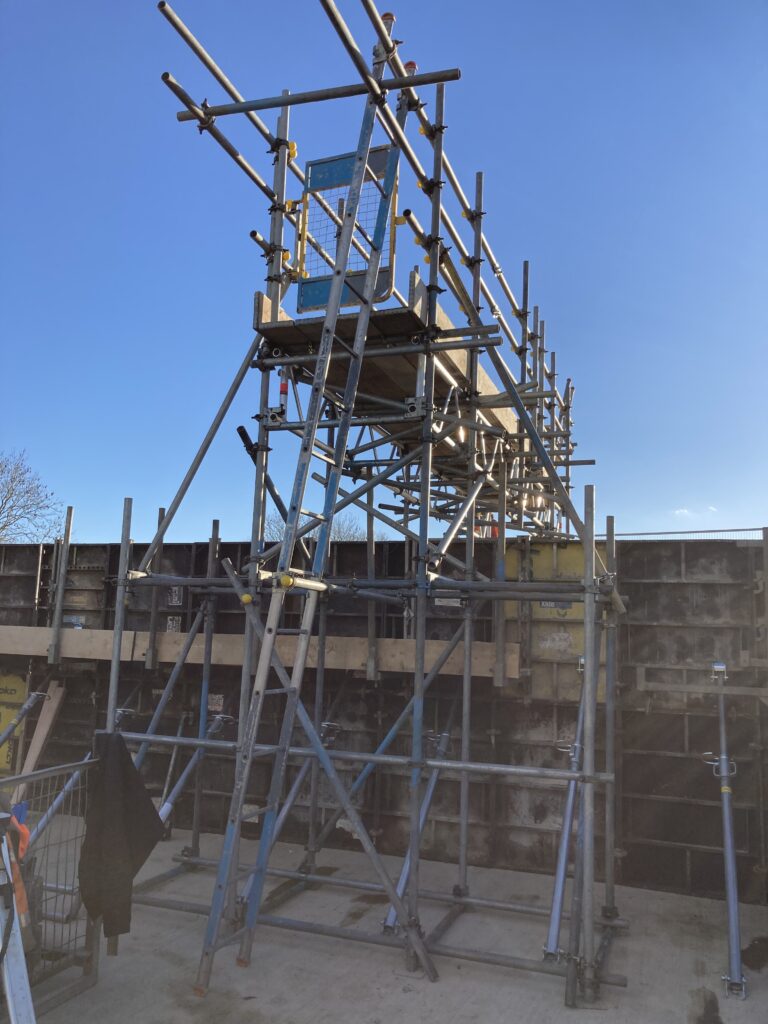 a small amount of scaffolding and other safety equipment on a construction site