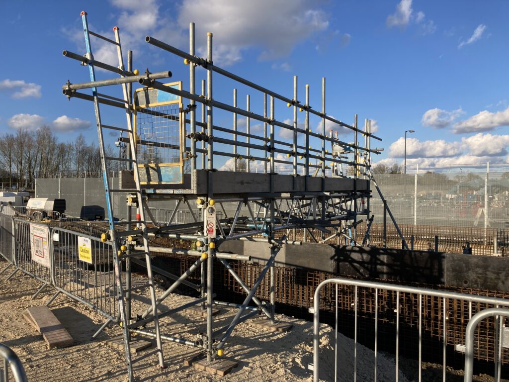 a small amount of scaffolding on a construction site