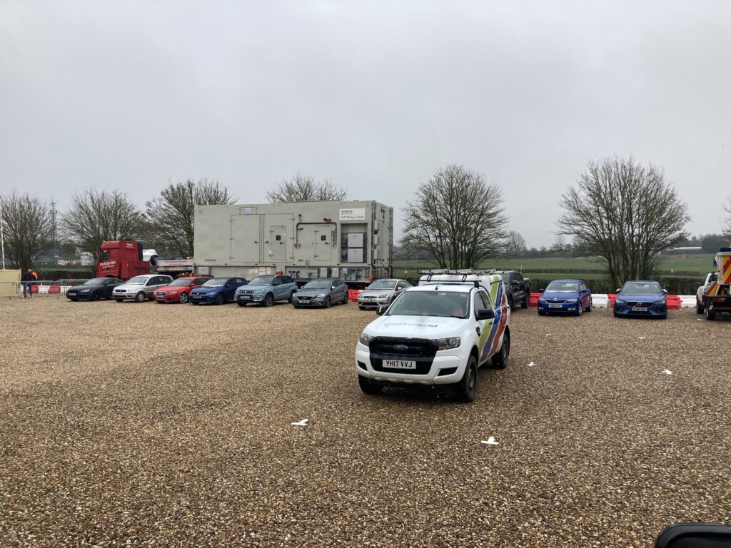 a lorry moving a gas turbine onto a construction site for installation