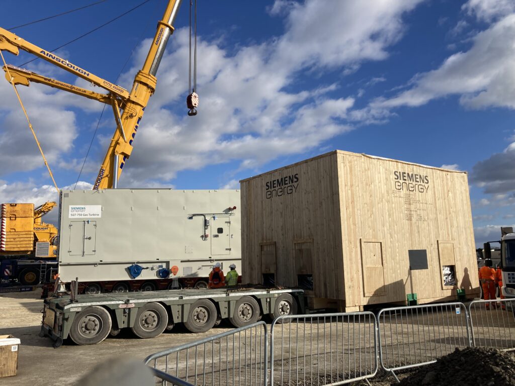 a covered gas compressor on the back of a lorry