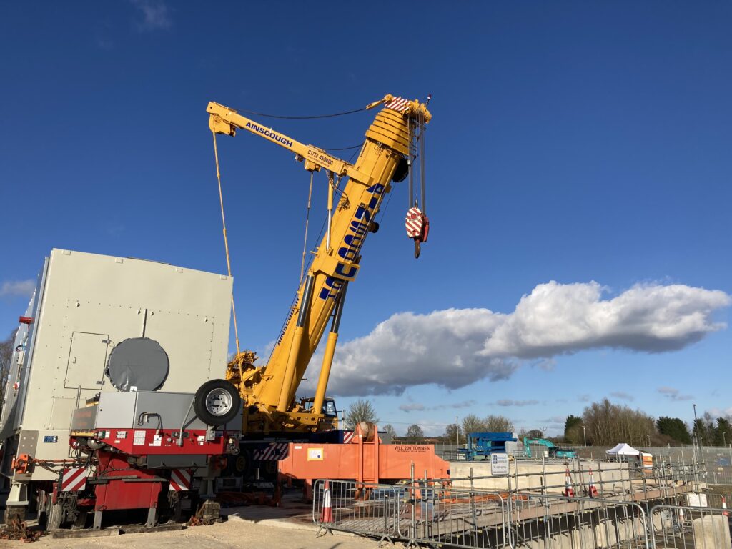 a crane and scaffolding equipment on a construction site