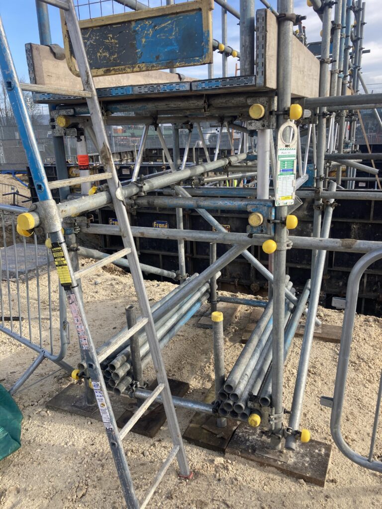 a small amount of scaffolding on a construction site