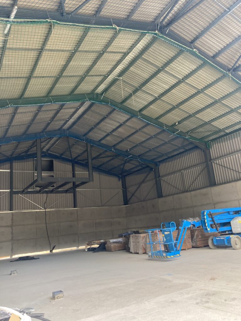 Safety netting inside a barn for a safe solar panel installation